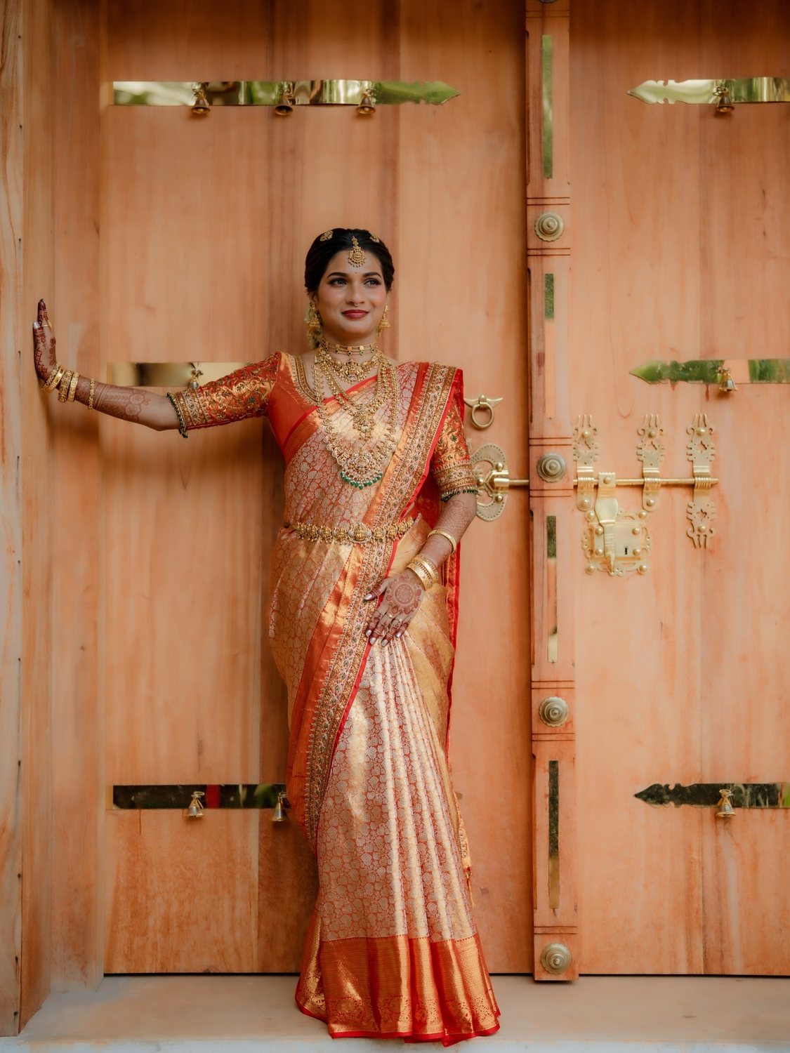 Bride at carved wooden doors
