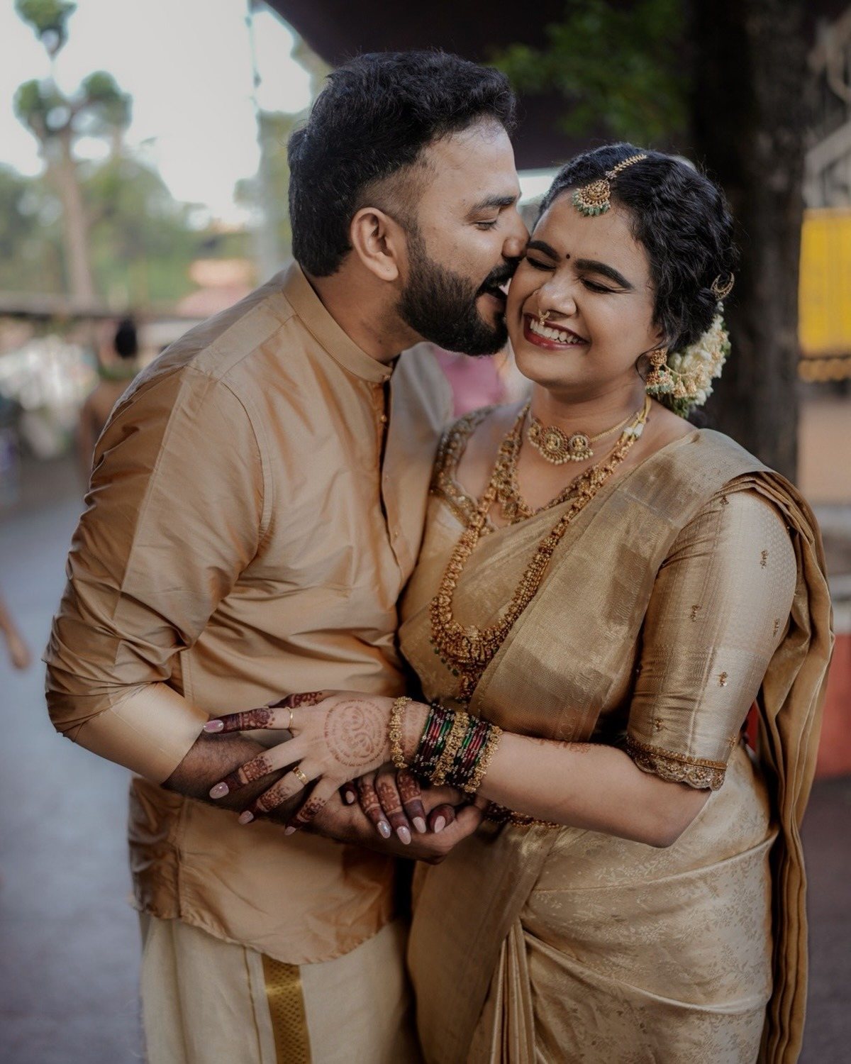 Couple in cream and gold