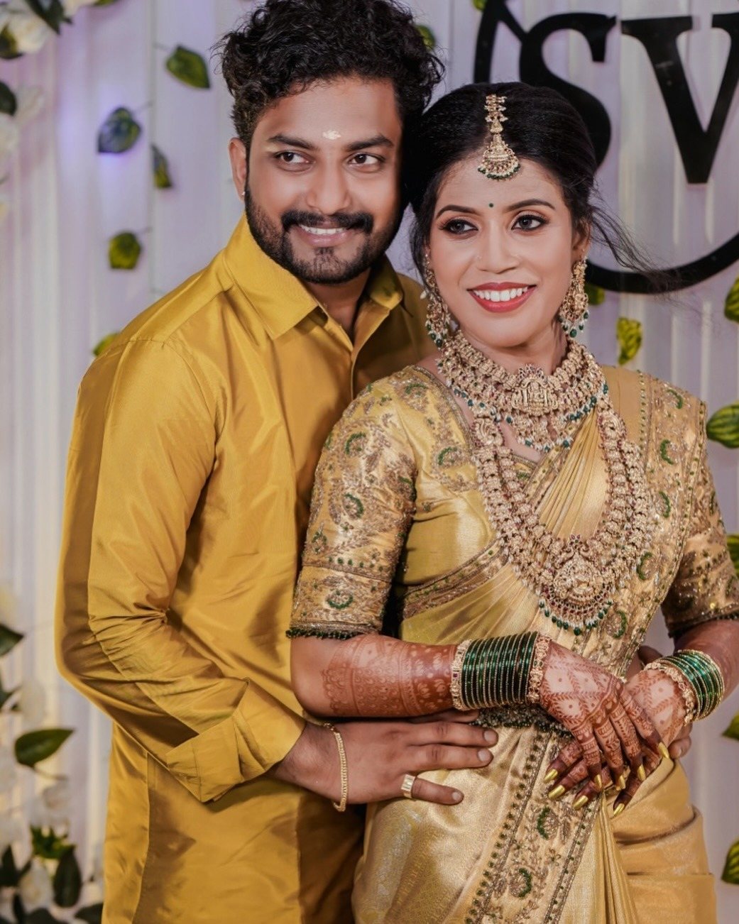 Couple in gold wedding attire